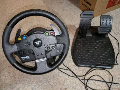 Thrustmaster TMX racing wheel and pedal set in good (great?) condition. No problems with it, and not...
