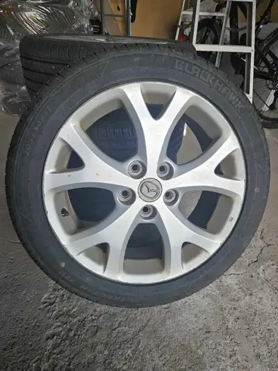 4 x Blackhawk Street-H HH11 all season touring tires on alloy mazda rims. 7-8 mm avg tread depth. Ti...