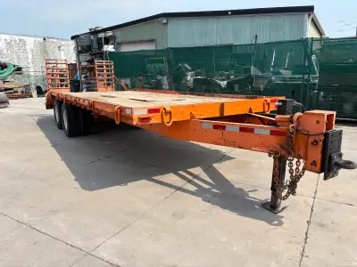 Dual wheel float tag trailer. 18’ bed plus 5’ beaver tail. Has been sandblasted , epoxy primed and p...