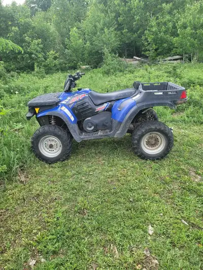2005 Polaris ATP 330. Starts right up and goes. Automatic transmission. Dash is out. Tilt bed. Ball...