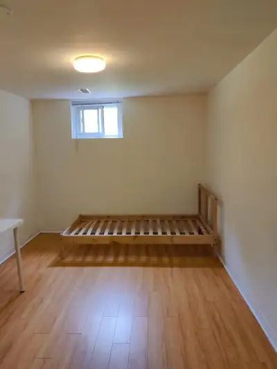 A new renovated and bright Bedroom in a basement apartment with separate entrance in a peaceful neig...