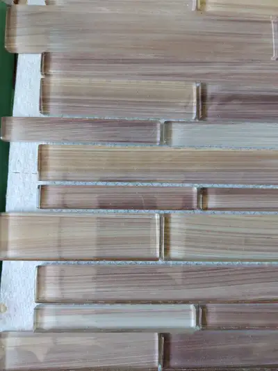 Glass mosaic tile 9 in total, measures 11 1/2" H x 11 3/4"W x 1/4", might be good for a small space...