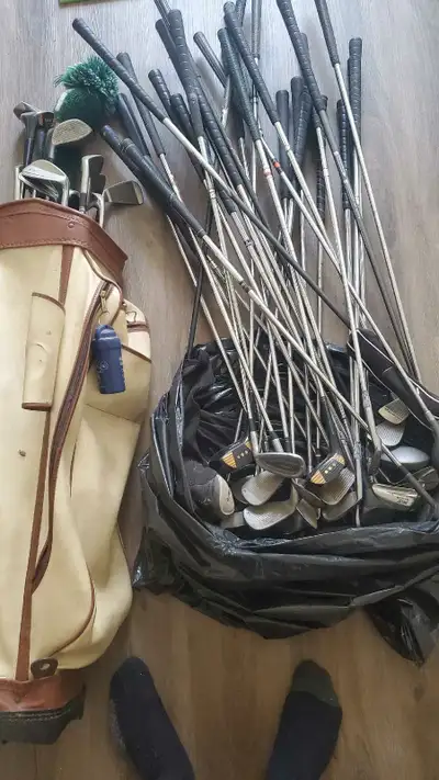 lots of golf clubs and bag 50$, View more
