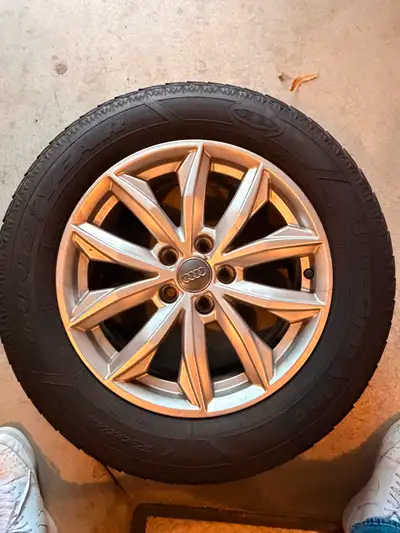 Selling a full set of 4 Goodyear UltraGrip winter tires (235/60R17) mounted on original Audi alloy r...