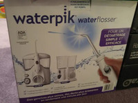 Waterpik Water Flosser Combo Pack, New - $59.00