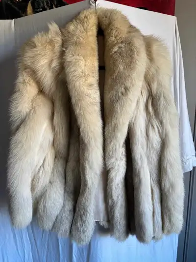 Beautiful Saga Fox fur coat, perfect for adding a touch of luxury to your wardrobe. This used coat f...