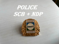 Épinglette police NDP + SCB