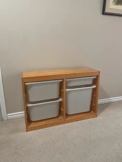 Solid pine storage unit. Comes with bins as shown , but fits IKEA bins if different sizes or colours...