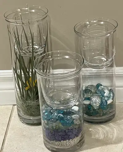 Beautiful trio of 3 glass candle holders with decor inside. , View more
