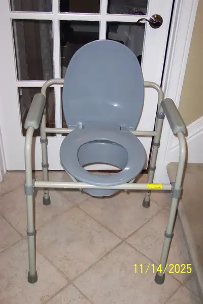 selling commode toilet seat no longer needed still in good condition, sturdy holds up to 350 lbs per...