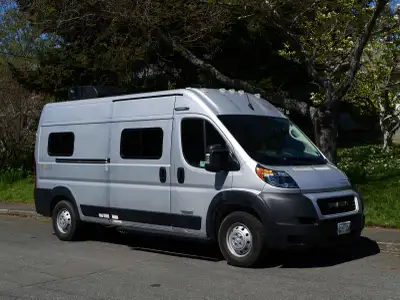 Adventure-ready camper van in excellent condition - kitchen with two burner cooktop and fridge, bath...
