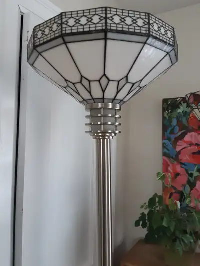 Geometric pattern. Excellent condition. 6'H. Shade is 13.5" in diameter. Heavy silver base. Price is...