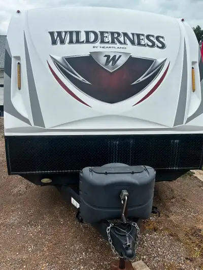 • Model: Heartland Wilderness 2475 BH • Year: 2016 • Type: Travel Trailer • Length: 28' 9" • Interio...