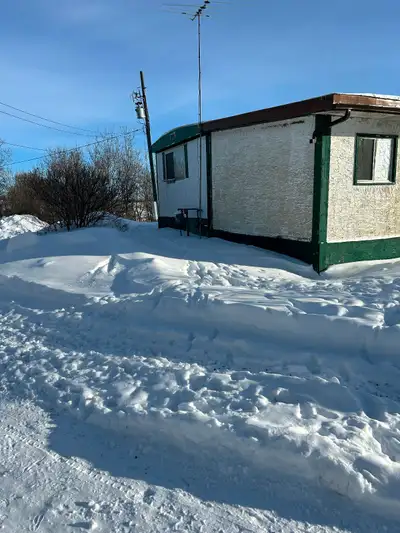 Mobile home, with attached addition and porch. To Be Moved. Has like new gas furnace. Free to be mov...