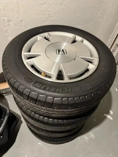 Set of 4 original Honda Civic (2009) wheels mounted on Michelin Defender all-season tires. Tires hav...
