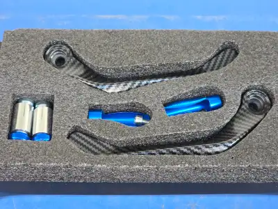 For sale a set of brand new, still in the box Kawasaki ZX14R RACING Lever Guard Carbon Fiber Look. F...
