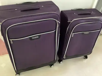 Two pieces of luggage for sale. Purple coloured. Cash only. Must pickup. Asking $75.00 for both. One...