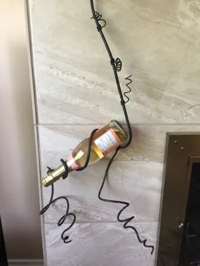 HAND CRAFTED WROUGHT IRON BOTTLE HANGER, View more