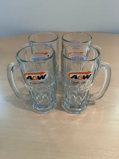 Classic glass mugs with A&W logo. Set has four heavy glass mugs with sturdy handles. Clear glass mat...