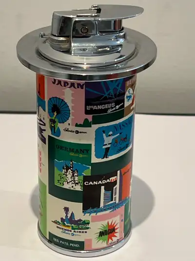 A cool vintage lighter featuring a collage of travel-themed images and locations like Beirut, Nassau...