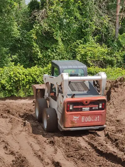 Skid steer work with operator Lots of experience in Land clearing Tree work Driveway install/grade B...