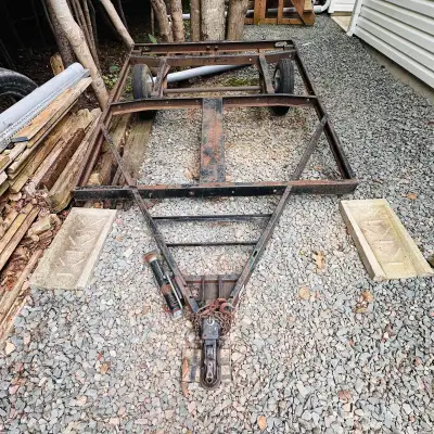 Steel frame utility trailer ready for build . Approx 8’x8’ AFrame, has rear bumper jack, chains and...