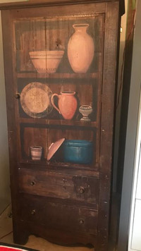 Wooden kitchen cabinet with decoupage on it