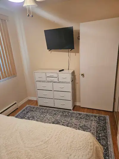 Fully furnished room with shared use of house, queen size bed, dresser, night stand and tv with Sams...