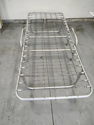 Antique folding roll-away twin bed. Sturdy, solid, light weight, easy to use. Purchased new in the 1...