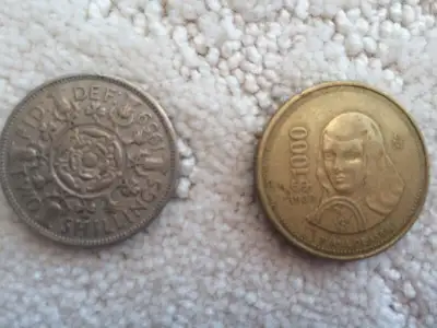 One coin from Mexico (1989) $1000 Mexican currency, and one British coins 1959. Please call or text...