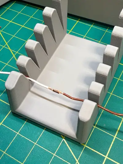 It works for wires from AWG-6 to AWG-30. Material: PLA Size: 56mm x 40mm x 33mm (L x W x H)