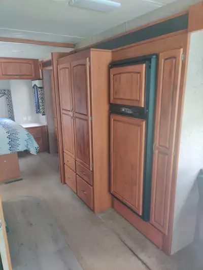Victron solar, 40,000 miles, super-slide, dual a/c, built in vacuum, electric awning, 2 door fridge...