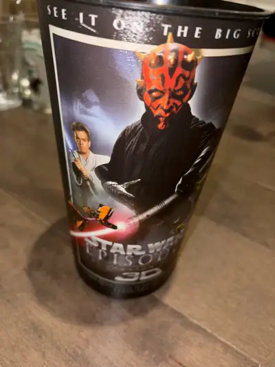 Relive the excitement of Star Wars Episode 1 with this collectible plastic cup featuring iconic char...