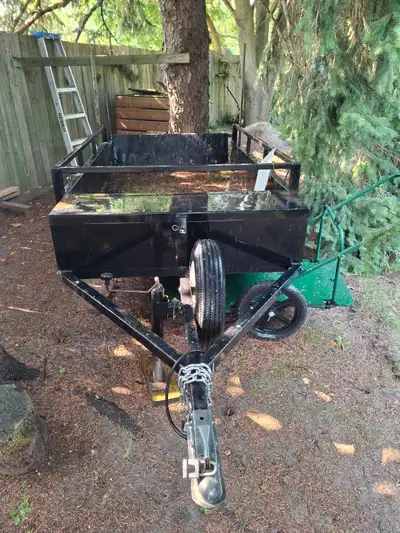 5x8 all steel ,rear lights, large utility box in front for chain saws etc, 1 1/2 " hitch, spare tire...
