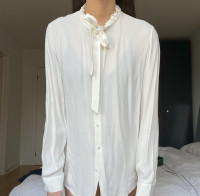 Cream blouse with a bow