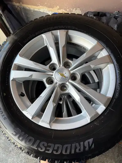 I am selling a set of 225/65/17 Bridgestone winter tires mounted on 17-inch Equinox rims. The tires...