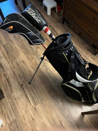 Golf bag with stand and 2 clubs