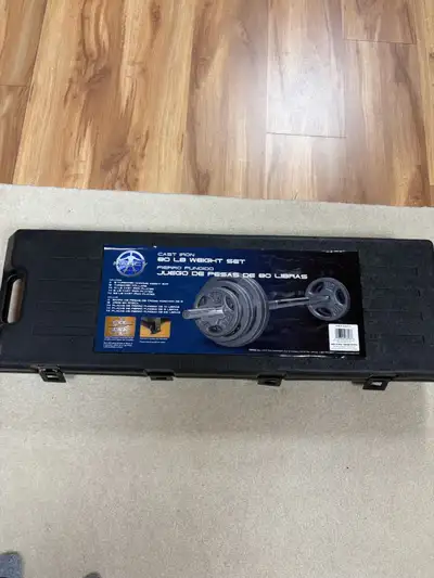 Work out bench for leg and bench press, assorted weights and 60 pound weight set in original case fo...