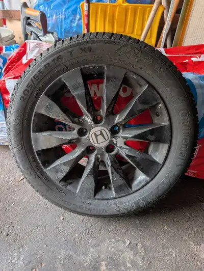 Selling a used Continental VikingContact 7 winter tire. The size is 205/55R16. It's mounted on a Hon...