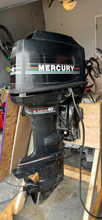 Mercury 40hp 2 stroke outboard with spare parts