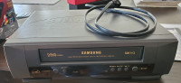 Samsung VCR with digital file converter, dvd's and jewel cases.