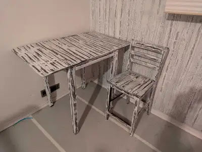 table and two chairs. It's bar height, View more