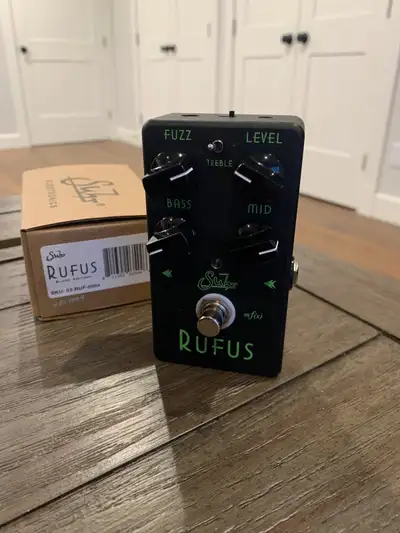 It’s “Big Wreck in a box” with the Suhr Rufus in this sleek Limited Edition Black! This boutique fuz...