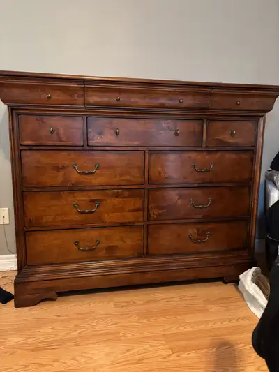King size bed with wood frame. Matching dresser and 1 matching night table. Selling as we are downsi...