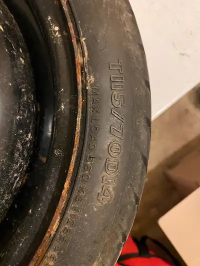 This is a used 14-inch temporary tire with a T115/70D14 specification, perfect as a spare. As it's s...