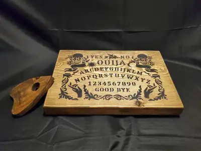 Ouija board complete with planchette. Measures about 12 x 9 inches. Perfect for the Halloween season...