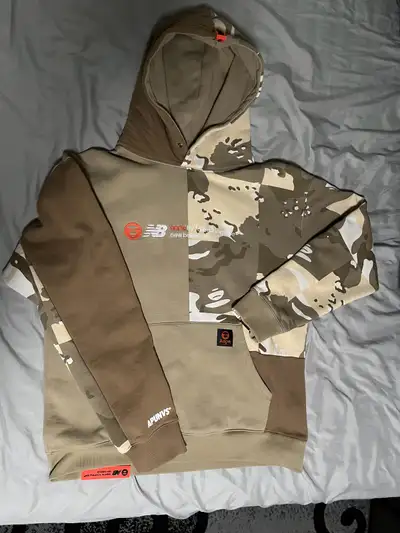 Rare collab hoodie from AAPE by A Bathing Ape x New Balance. Camo version — sold out fast. Size: Lar...