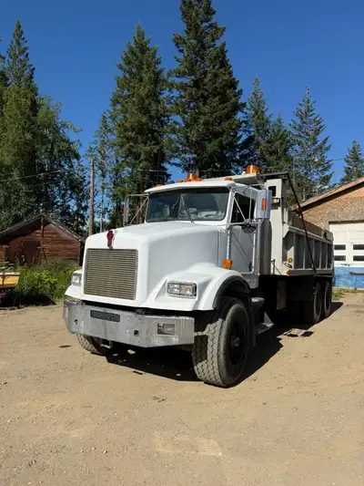 Kenworth dump truck Knight box in good shape, still has transfer rails and plywood sides for paving....