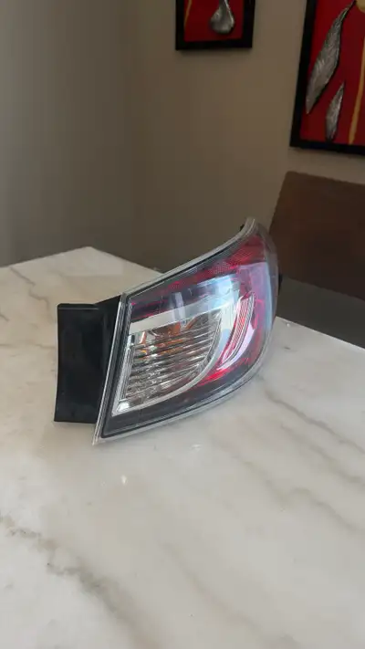 I'm offering a used Mazda 3 tail light from the 2011-2013 model years. This tail light is in good co...