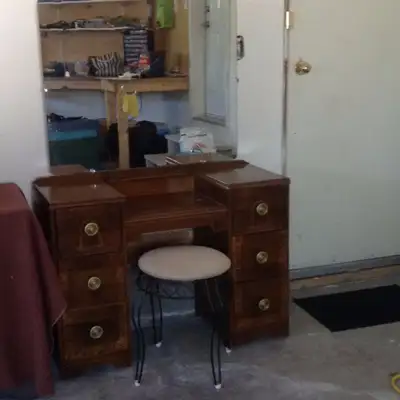 Antique vanity with swivel stool Good condition. You may wish to refinish the top. Measures 39 1/2"...